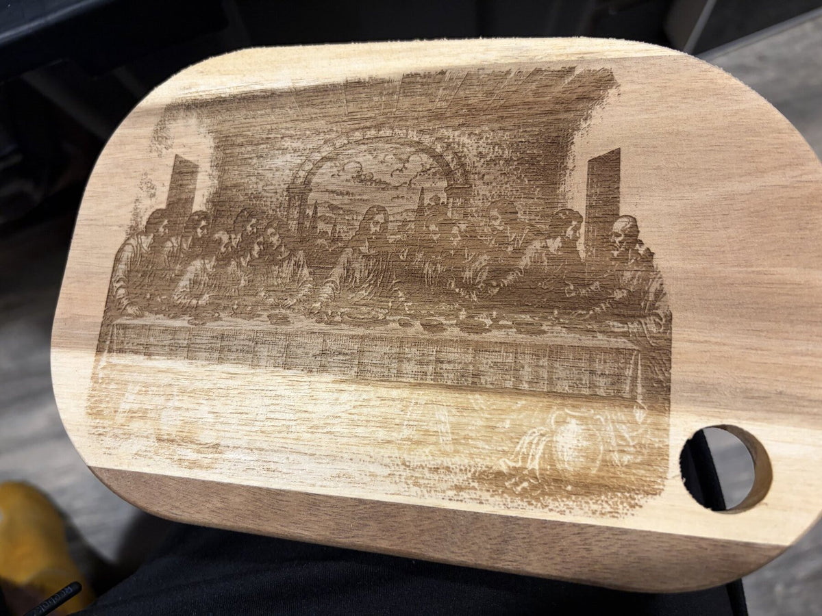 Engraved wood board showing detailed fine-art image reproduction